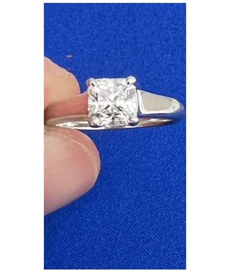 TIFFANY NOVO CUSHION CUT DIAMOND ENGAGEMENT RING.