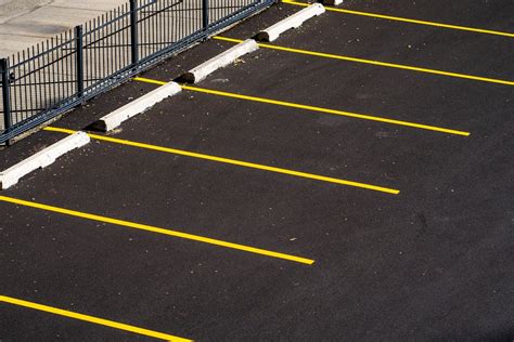 Yellow Lines on the Ground of Parking Lot · Free Stock Photo