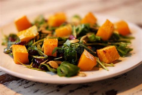 Salad with Pumpkin, Pumpkin Seeds and Arugula Stock Image - Image of feta, fresh: 105675133