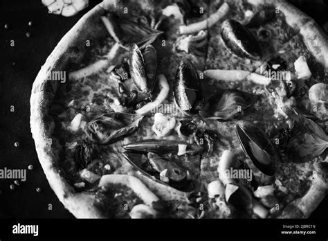 delicious italian pizza with fresh seafood Stock Photo - Alamy