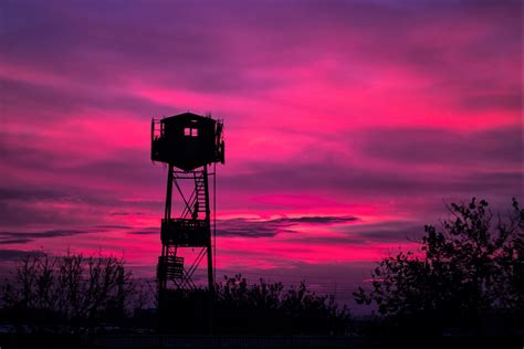 Download Silhouette Watchtower Pink Sky Photography Sunset HD Wallpaper