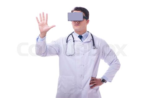 Doctor wearing a vr virtual reality headset isolated on white ba | Stock image | Colourbox