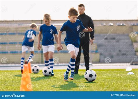 Young Boys in Sports Soccer Club on Training Unit. Kids Improve Soccer Skills on Natural Turf ...