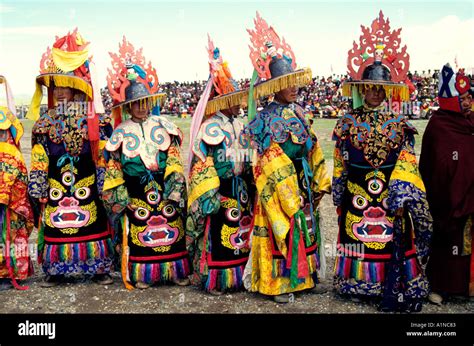 monks of the ancient Bon religion play a traditional role as they ...