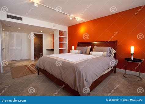 Bedroom with orange wall stock image. Image of neutral - 28082981