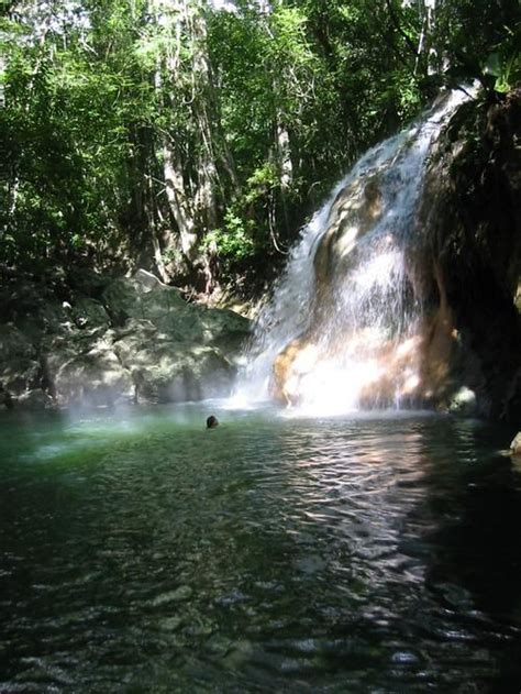 Rio Dulce, Guatemala Where a hot springs waterfall runs into a cool river swimming pool. Most ...