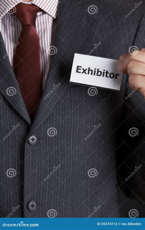 Businessman Attaching Exhibitor Badge To Jacket Stock Photo - Image of business, human: 45374112