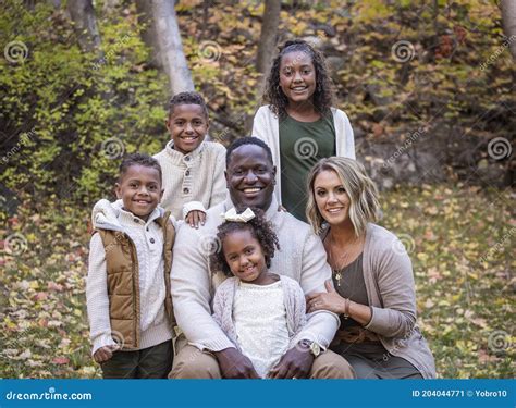 Posed Mixed Race Family Portrait Outdoors with Autumn Colors Stock ...