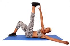 Fitness Woman Doing Toe Touch Crunches – Ab Exercise