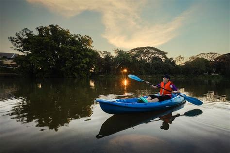 Premium Photo | Kayaking water sports with copy space young kayaker man ...