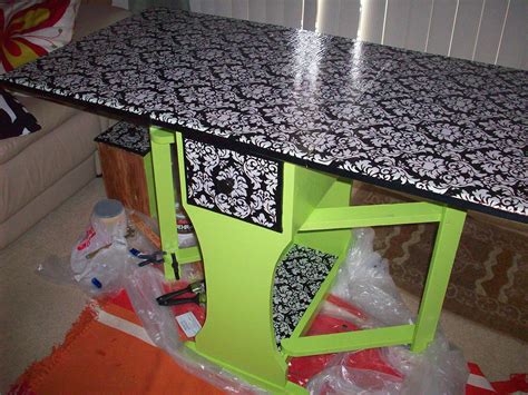 a green table with black and white designs on it