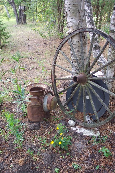 Rusty Milk Can And Wagon Wheel Free Stock Photo - Public Domain Pictures