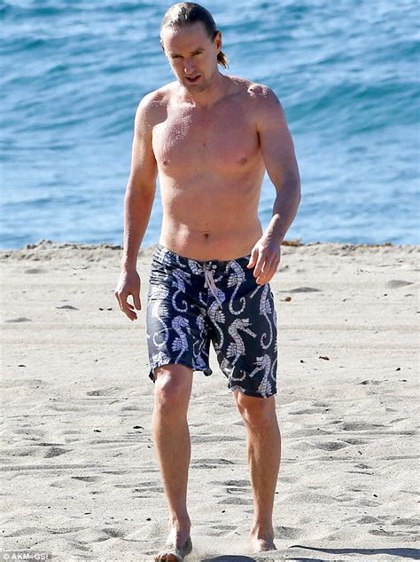 Owen Wilson swims in the ocean after getting personal trainer Caroline Lindqvist pregnant ...