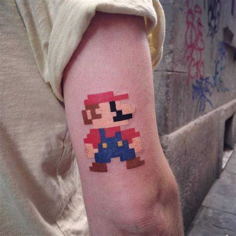 Pixel art Mario Bros tattoo on the back of the right upper arm | Mario tattoo, Gaming tattoo ...