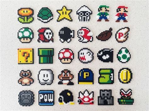 an array of pixelated video game icons on a white surface, including ...