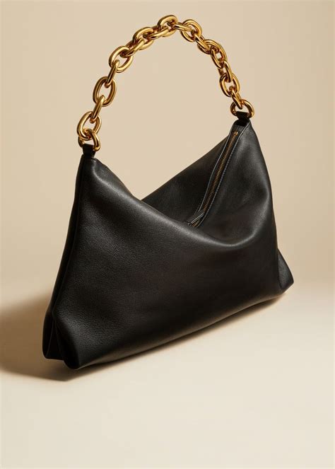 Description Debuting with the Pre-Fall 2023 collection, this pebbled leather shoulder bag ...