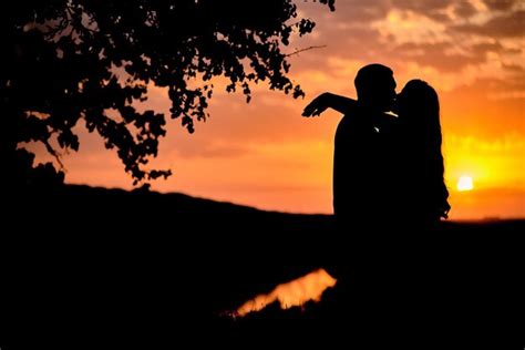 Premium Photo | Silhouette photo of a couple at sunset