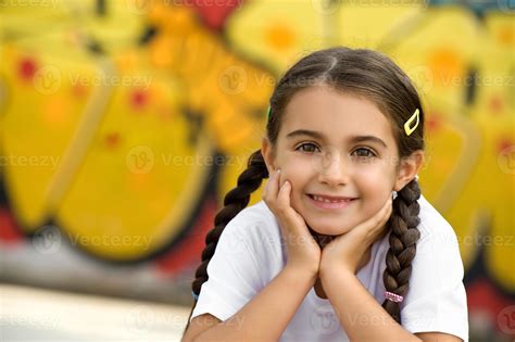 Smiling Cute Little Girl with Hands on Face 1256540 Stock Photo at Vecteezy