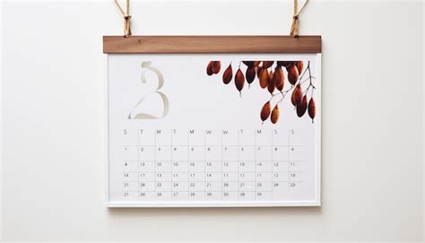 Premium AI Image | a wall calendar hanging on a white wall