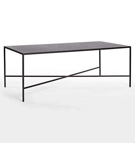 a black coffee table with metal legs and a rectangular top, on a white background