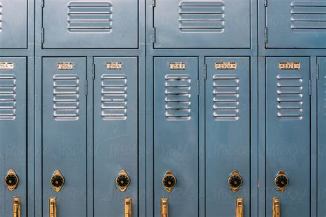 "Blue Lockers In A High School Hall" by Stocksy Contributor "Gabi Bucataru" - Stocksy