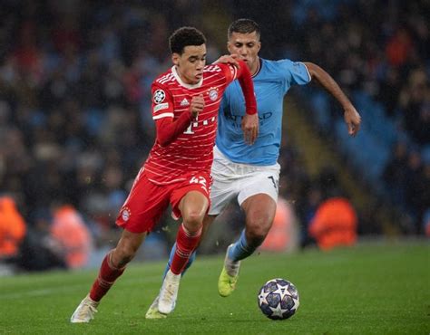 two men are playing soccer on the field