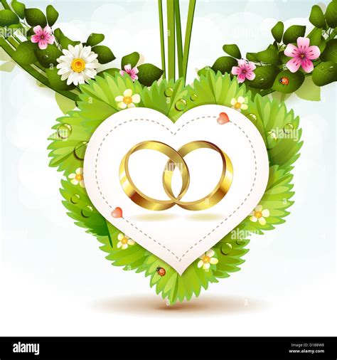 Two wedding ring on white shape heart Stock Photo - Alamy