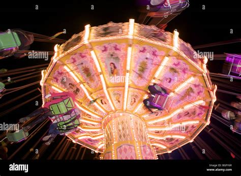 Carousel fairground ride at night Stock Photo - Alamy