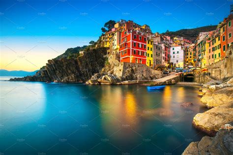 Riomaggiore at sunset cinque terre containing riomaggiore, manarola, and | Cinque terre ...