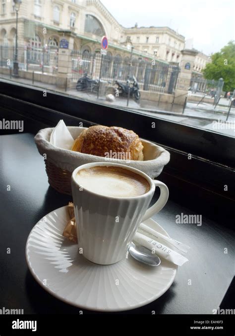 Paris, France. 27th Aug, 2014. A cup of coffee and a croissant on a ...
