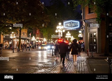 Nightlife on the streets of Gastown in Vancouver, Canada. Lamplighter Public House Stock Photo ...