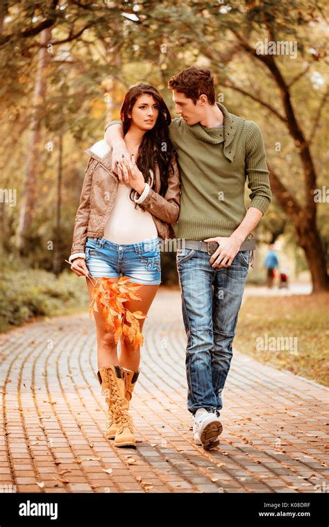 Beautiful lovely couple walking and enjoying in the park in autumn Stock Photo: 155079779 - Alamy