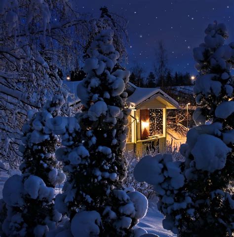 Illuminated house on snowy Christmas evening | Stock image | Colourbox