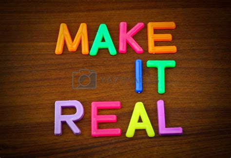 Make it real in colorful toy letters on wood background by nuchylee ...