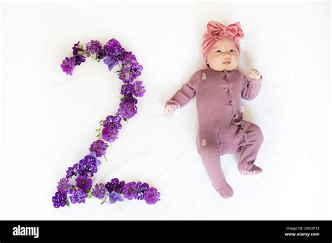 2-month-old baby girl. Baby milestone two months. Two month old baby Stock Photo - Alamy