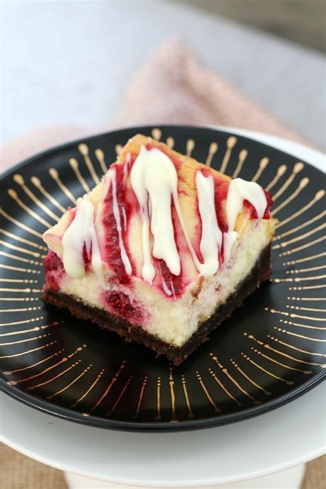 The BEST White Chocolate & Raspberry Cheesecake Slice - Bake Play Smile