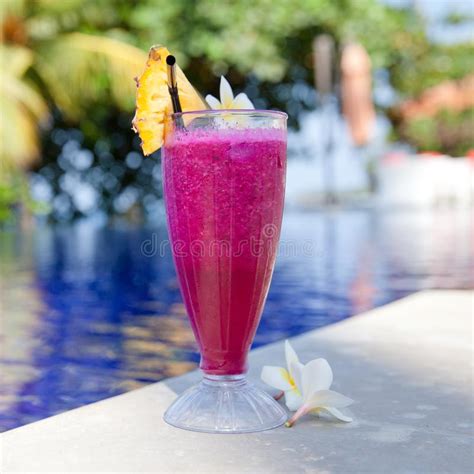 Dragon Fruit Juice in a Glass by the Pool. Stock Photo - Image of juice, glass: 135290482