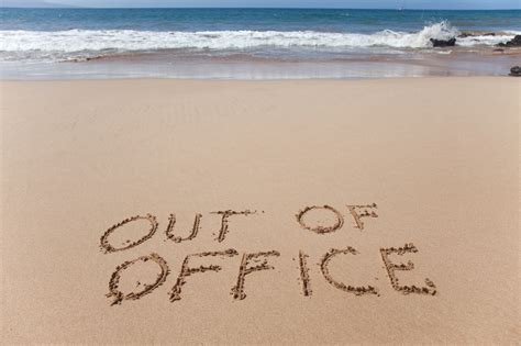 Out of office. Concept image in the sand on Hawaii beach.