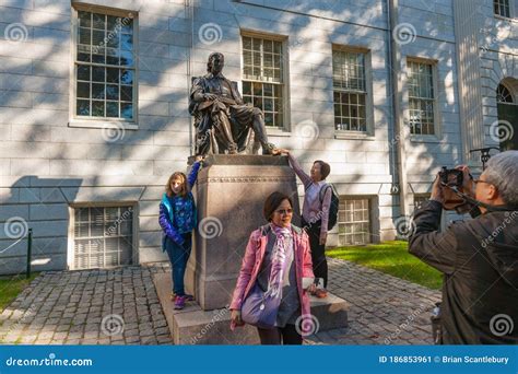 John Harvard Statue and Passers-by and Visitors Outside Harvard ...