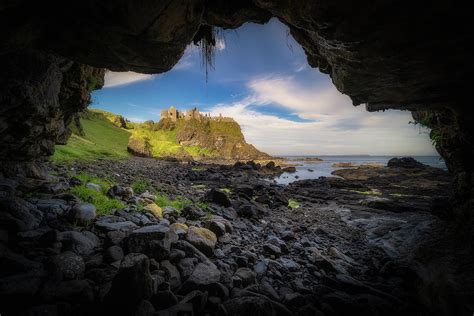 Dunluce Castle from a cave Photograph by Dawid Kalisinski - Fine Art ...