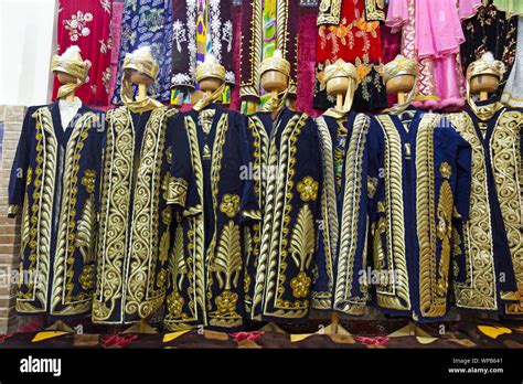 Traditional Uzbek costume being sold in a store in Samarkand ...