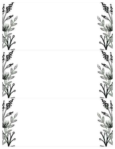a black and white photo frame with flowers in the middle, on a white background
