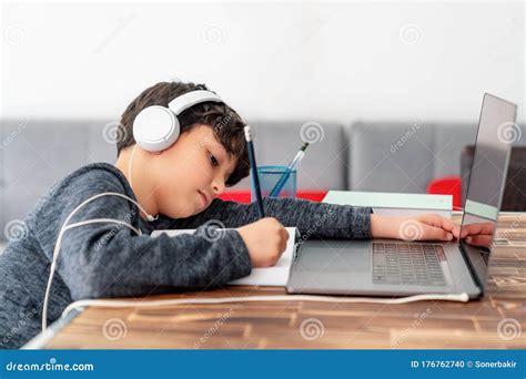 Little Boy is Studying in Front of the Laptop. E Learning, Study at Home Online. Stock Photo ...