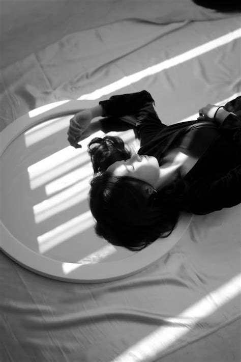 Grayscale Photography of a Woman Lying on Bed · Free Stock Photo