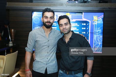 Virat Kohli with his brother Vikas Kohli during special dinner for ...