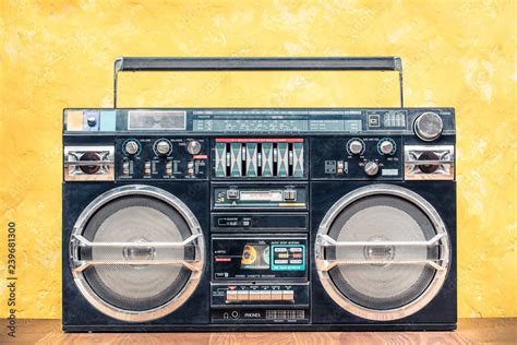 Retro outdated portable stereo boombox radio receiver with cassette recorder from circa 80s ...