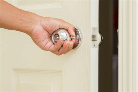 Premium Photo | Man hand open door knob