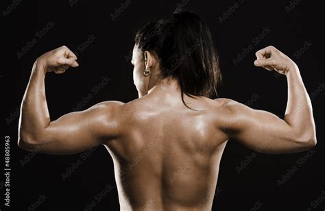 Back muscles of naked fitness woman. Stock Photo | Adobe Stock