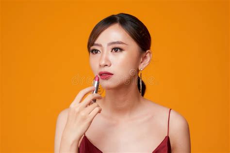 Beautiful Woman is Applying Her Lips with Red Lipstick Stock Image - Image of holding, makeup ...