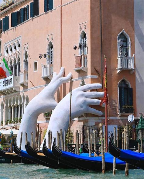 Contemporary Sculpture by Lorenzo Quinn Emerges from Venice's Lagoon